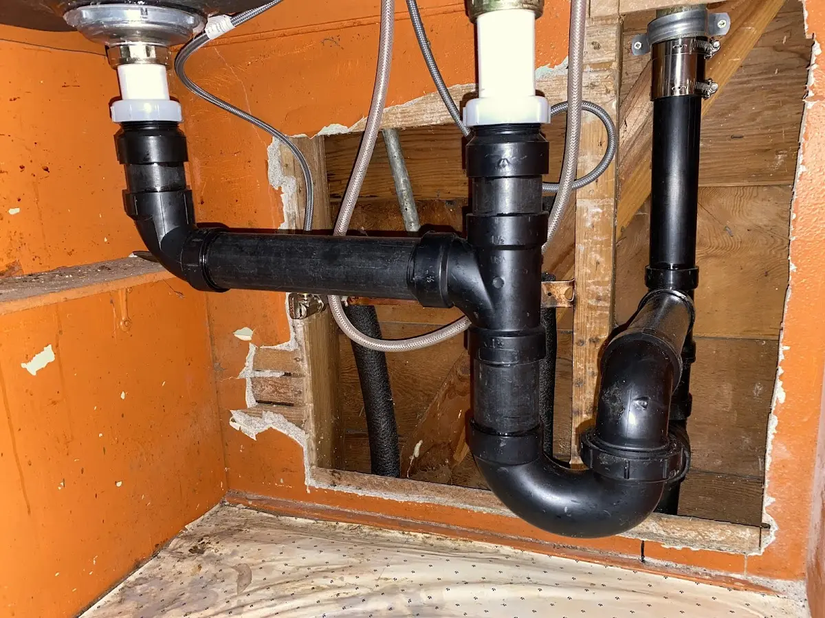 Professional Garbage Disposal Repair equipment and tools on the job in Genesee